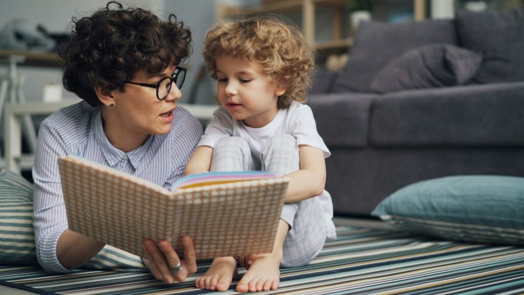 Parent sharing one of the best books for toddlers with a young child